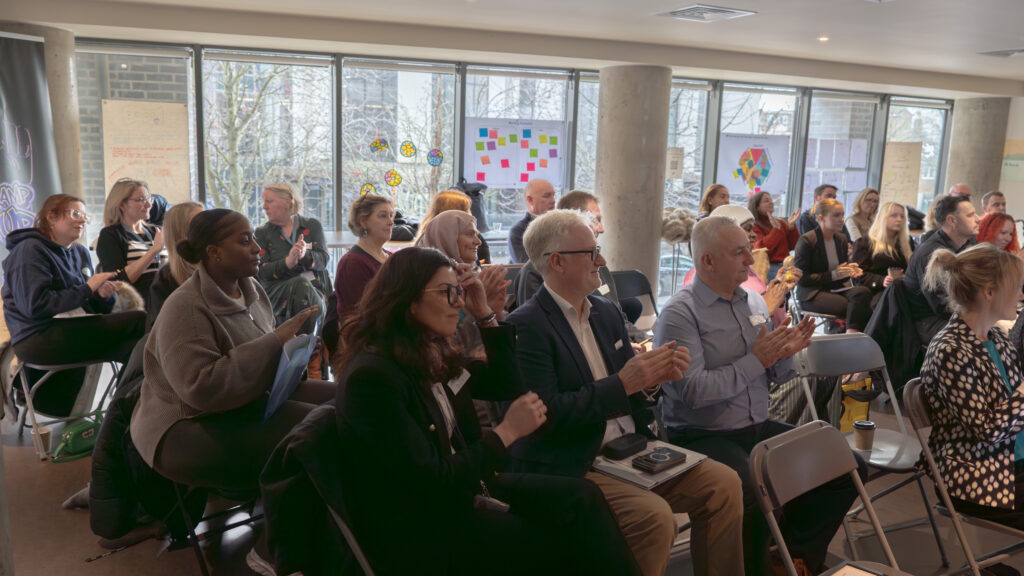 A room full of suppliers and community organisation representatives watching presentations at A2 Dominion’s first Social Value matching event, focused on building meaningful local partnerships